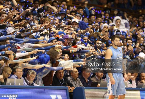 Fans watch on as Luke Maye of the North Carolina Tar Heels waits to throw the ball in bounds against the Duke Blue Devils during their game at...