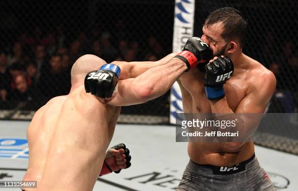 Volkan Oezdemir of Switzerland punches Dominick Reyes in their light heavyweight bout during the UFC Fight Night event at The O2 Arena on March 16,...