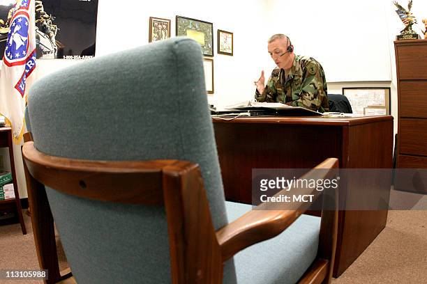 Sergeant First Class Timothy J. Waud, Station Commander of U.S. Army Recruiting Station in Simi Valley, California, sits at his desk across from an...