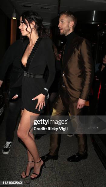 Aarika Wolf and Calvin Harris seen attending the Sony Music BRITS 2019 After Party at The Shard on February 20, 2019 in London, England.