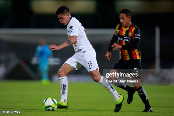 Juan Iturbe of Pumas fights for the ball with Angel Hernandez of Leones Negros during the match between Pumas UNAM and Leones Negros as part of the...