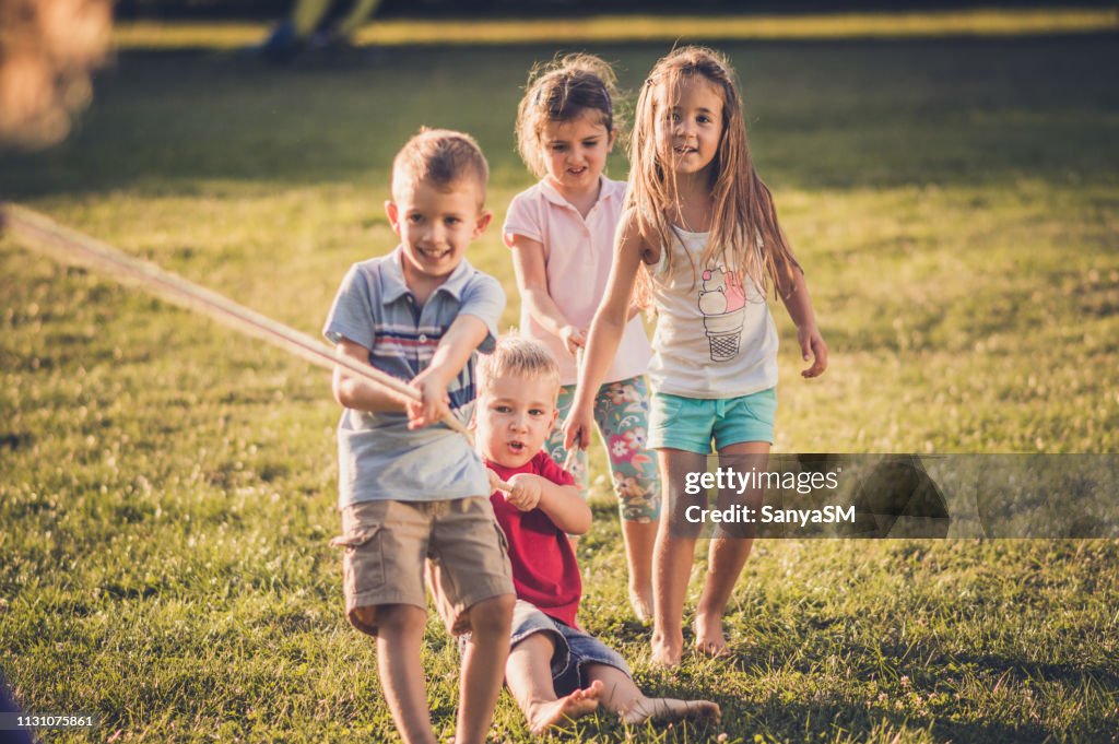 Group Of Kids Pulling A Rope High-Res Stock Photo - Getty Images