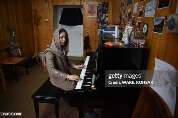 In this photo taken on February 19 Afghan conductor Negina Khpalwak the first female orchestra conductor in Afghanistan, plays piano at the...