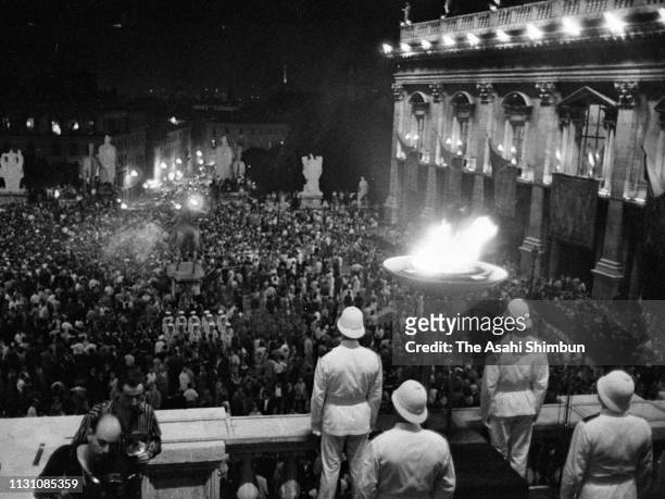 The Olympic torch is lit at the cauldron as the torch relay continues on August 24, 1960 in Rome, Italy.