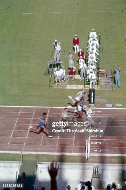Armin Hary of Germany crosses the finish line in the Men's 100m Semi Final of the Rome Olympic Games at the Stadio Olimpico on August 31, 1960 in...