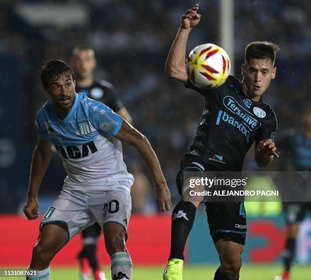 Belgrano's defender Tomas Guidara vies for the ball with Racing Club's forward Dario Cvitanich during their Argentina First Division Superliga...