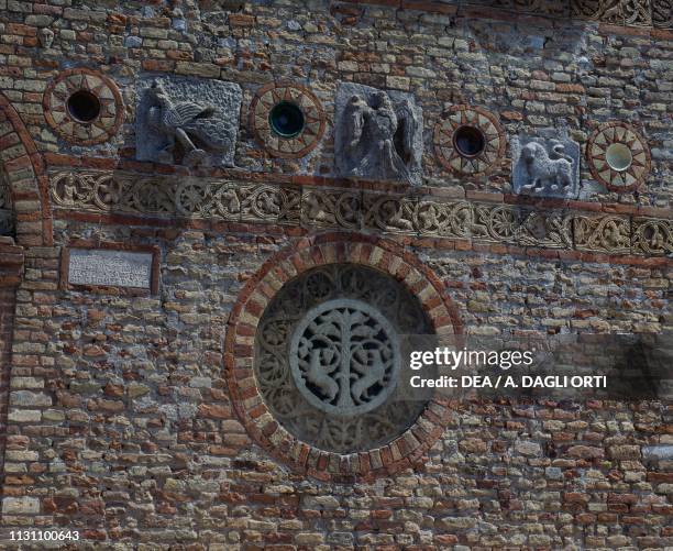 Oculus with decorative patterns on the facade of the Pomposa Abbey, Codigoro , Emilia-Romagna, Italy, 9th century.