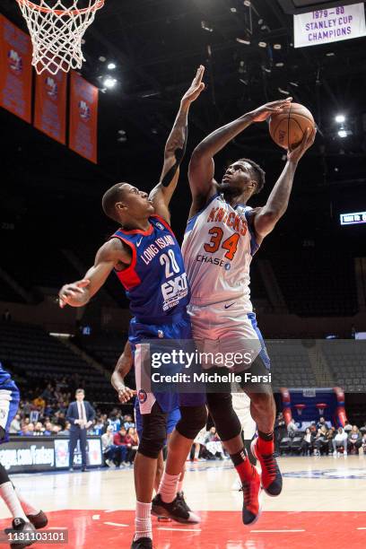 Jameel Warney of the Westchester Knicks shoots against Thomas Winbush of the Long Island Nets during an NBA G-League game on March 16, 2019 at NYCB...