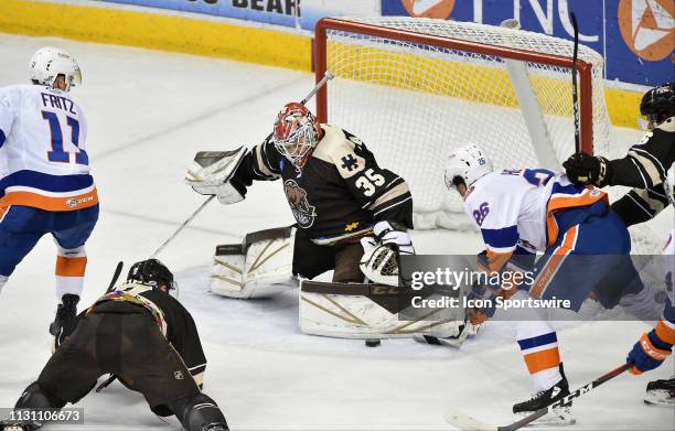 Hershey Bears goalie Ilya Samsonov makes a save on Bridgeport Sound Tigers right wing Josh Ho-Sang during the Bridgeport Sound Tigers vs. The Hershey...