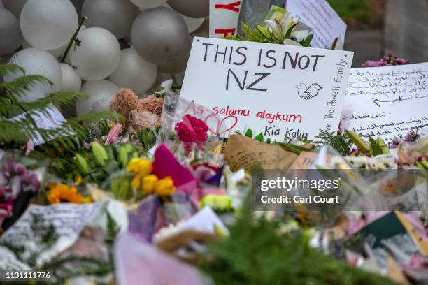 Messages and flowers are left near Al Noor mosque on March 17, 2019 in Christchurch, New Zealand. 50 people are confirmed dead, with 36 injured still...