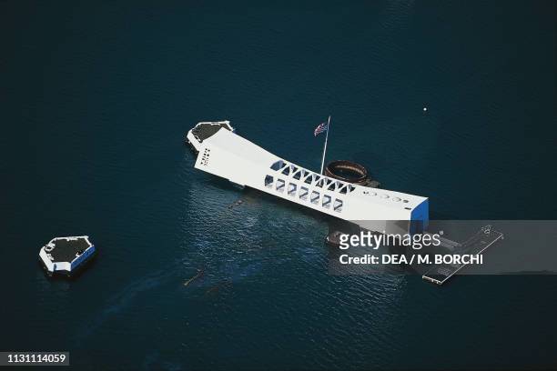 Aerial view of the USS Arizona Memorial, monument in memory of the USS Arizona battleship which was sunk during the Japanese attack on December 7...