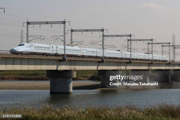 Shinkansen bullet train runs cross Kakogawa River between Nishi-Akashi and Himeji Stations on October 19, 2018 in Takasago, Hyogo, Japan.