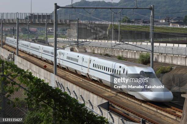 Shinkansen bullet train runs between Hakata and Shin-Tosu Ststion on June 18, 2016 in Tosu, Saga, Japan.