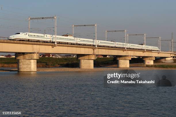 Shinkansen bullet train runs cross Kakogawa River between Nishi-Akashi and Himeji Stations on October 19, 2018 in Takasago, Hyogo, Japan.