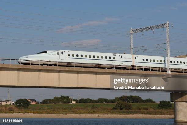 Shinkansen bullet train runs cross Kakogawa River between Nishi-Akashi and Himeji Stations on October 19, 2018 in Takasago, Hyogo, Japan.