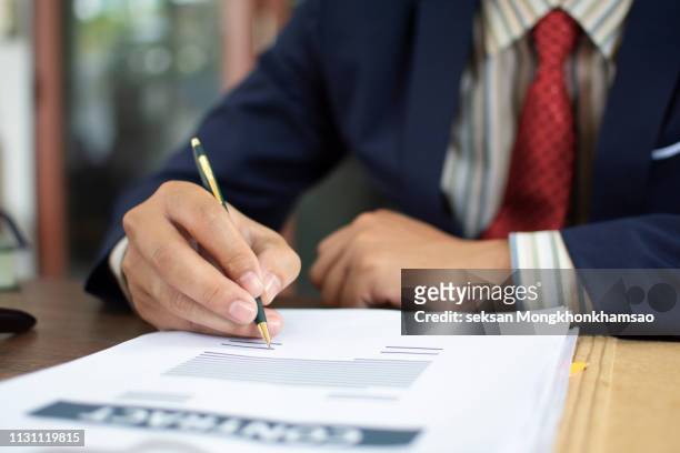 man signing contract. close up. deal concept - deal signing stockfoto's en -beelden