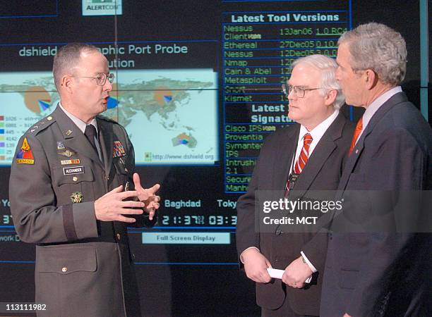 Lt. General Keith Alexander, director of the National Security Agency, left, and Threat Operations Center director, William P. Marshall, greet...