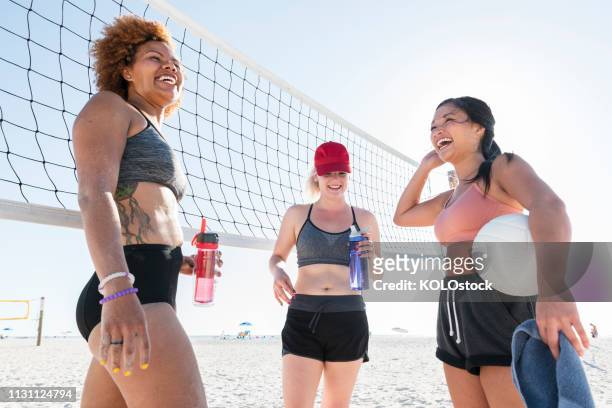 Young women playing volleyball