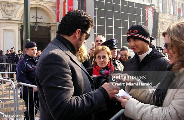 Italian ledgend and former Olympic ski champion Alberto Tomba signs autographs as he mingles with fans Thursday, February 9, 2006 at Piazza San Marco...