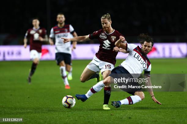 Cristian Ansaldi of Torino FC and Andrea Poli in action during the Serie A football match between Torino Fc and Bologna Fc. Bologna Fc wins 3-2 over...