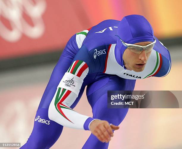 Italian Speedskater Enrico Fabris celebrates his run that earned him the bronze medal in tthe men's 5000m speed skating event at the Oval Lingotto...