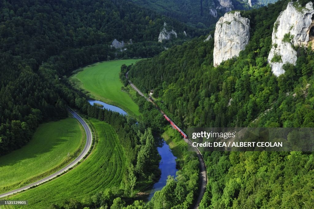 Train passing by Danube river, Danube Valley
