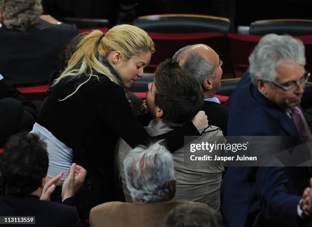 Colombian singer Shakira kisses Barcelona player Gerard Pique during the la Liga match between Barcelona and Osasuna at the Camp Nou stadium on April...