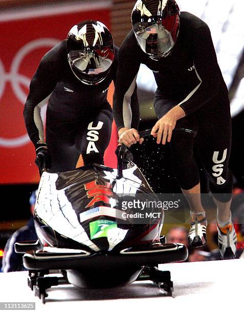 Pilot of bobsled Team USA-1 Todd Hayes and brake man Pavle Jovanovic begin begin their second run in the Men's 2-Man Bobsled competition at Cesana...