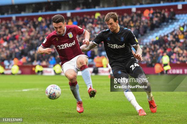 JohnMcGinn of Aston Villa battles with Middlesbrough defender Aden Flint during the Sky Bet Championship match between Aston Villa and Middlesbrough...