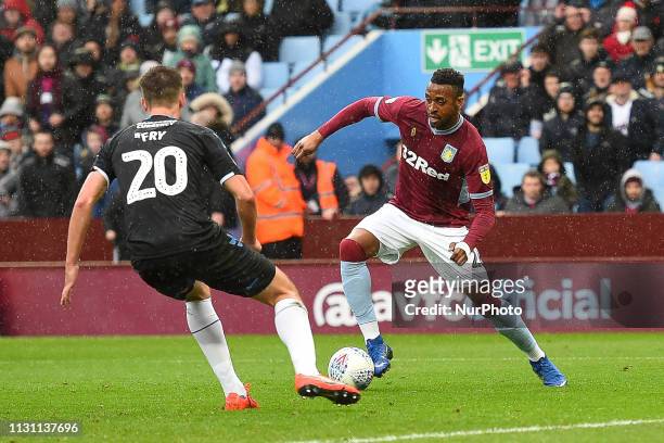 Jonathan Kodjia of Aston Villa battles with Middlesbrough defender Dael Fry during the Sky Bet Championship match between Aston Villa and...