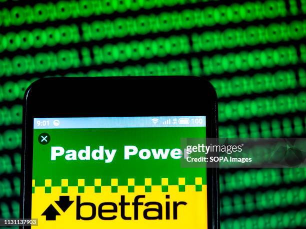 In this photo illustration, the Paddy Power logo seen displayed on a smartphone.
