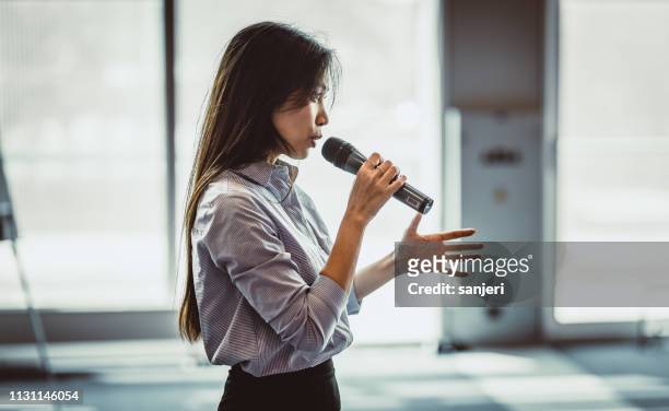 public speaker at a conference - speech stock pictures, royalty-free photos & images