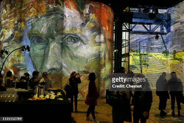 Visitors attend a press preview of the immersive exhibition "Van Gogh, Starry Night" devoted to painter Vincent Van Gogh by multimedia artist...
