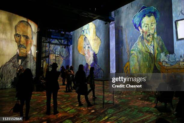 Visitors attend a press preview of the immersive exhibition "Van Gogh, Starry Night" devoted to painter Vincent Van Gogh by multimedia artist...