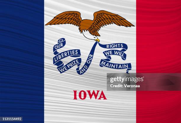 waving flag of iowa in united states. - iowa flag waving stock illustrations