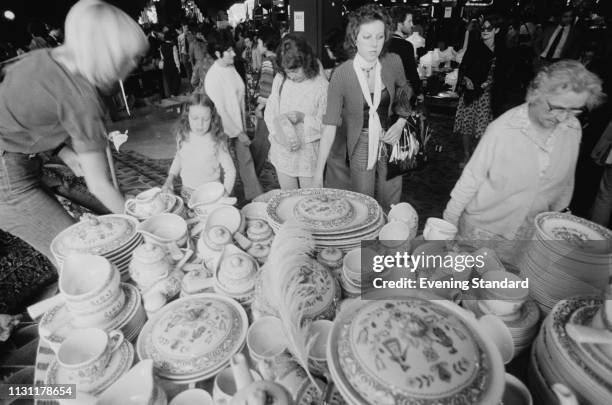 Costumers near in the crockery department at Biba, which is holding their last sale before closure, London, UK, 4th September 1975.