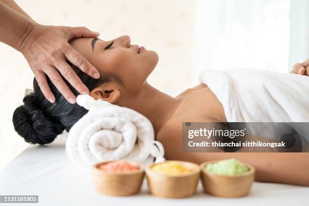 head massage - spa treatment stock pictures, royalty-free photos & images