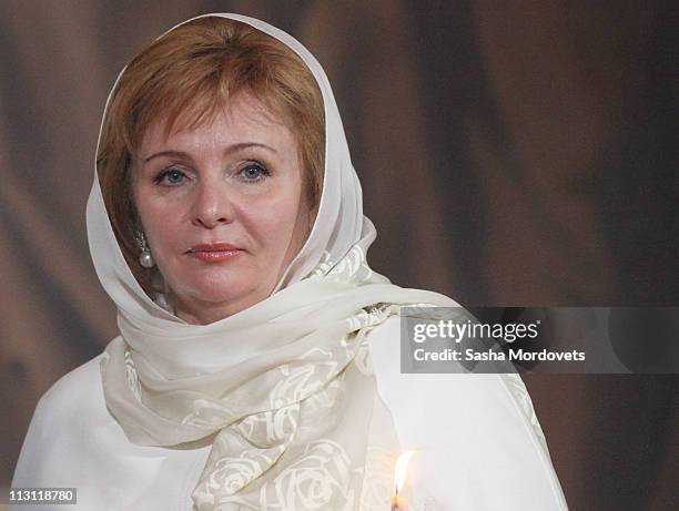 Russia's Prime Minister Vladimir Putin's wife Lyudmila Putina pray during an Orthodox Easter service in the Christ the Saviour Cathedral on April 24,...