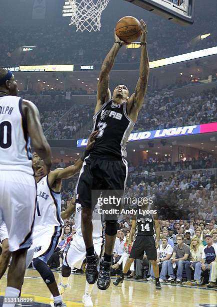 George Hill of the San Antonio Spurs shoots the ball during the game against the Memphis Grizzles in Game three of the Western Conference...