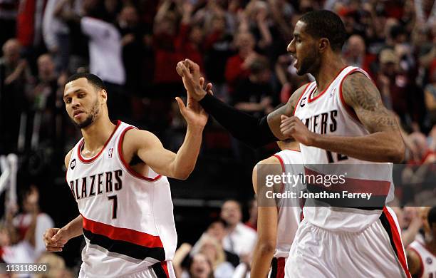 Brandon Roy high fives LaMarcus Aldridge of the Portland Trail Blazers against the Dallas Mavericks in Game Four of the Western Conference...