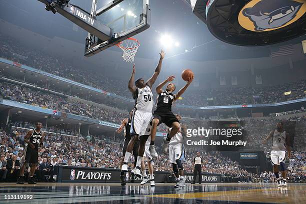 Tony Parker of the San Antonio Spurs shoots against Zach Randolph of the Memphis Grizzlies in Game Three of the Western Conference Quarterfinals in...