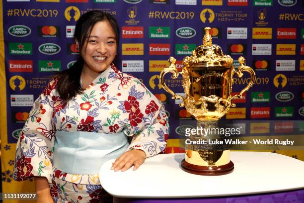Local fans pose with the Webb Ellis Cup at the Springbok Experience Museum during day one of the Rugby World Cup 2019 Trophy Tour on February 21,...