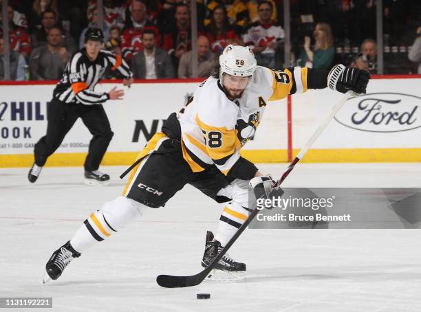 Kris Letang of the Pittsburgh Penguins skates against the New Jersey Devils at the Prudential Center on February 19, 2019 in Newark, New Jersey. The...