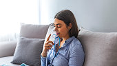 Woman makes inhalation nebulizer at home.