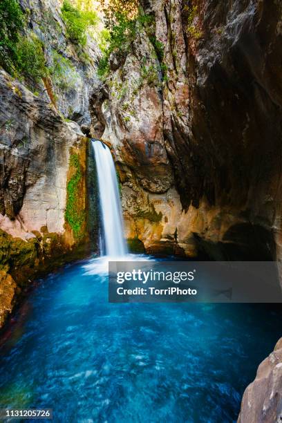 waterfall with blue water in a rocky sapadere canyon, turkey - natural landmark stock-fotos und bilder