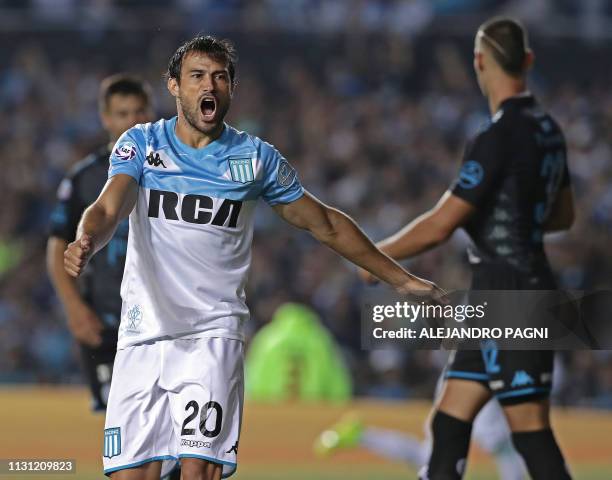 Racing Club's forward Dario Cvitanich celebrates after his teammate forward Lisandro Lopez scored a goal against Belgrano, during their Argentina...