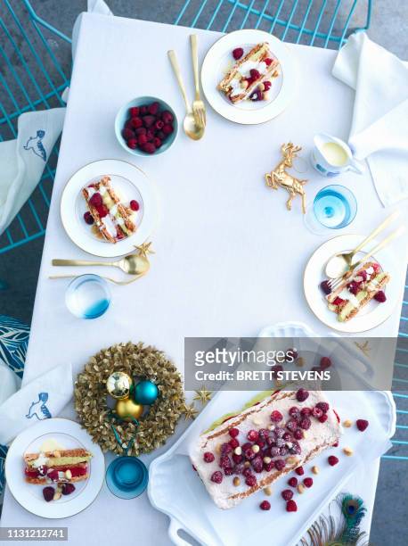 tray of raspberry macadamia vacherin layer cake on christmas table - christmas cake ストックフォトと画像