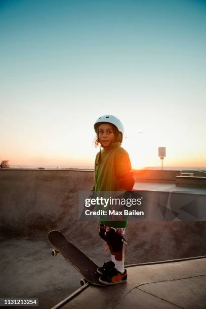 boy skating at skatepark - boy skatepark stock-fotos und bilder