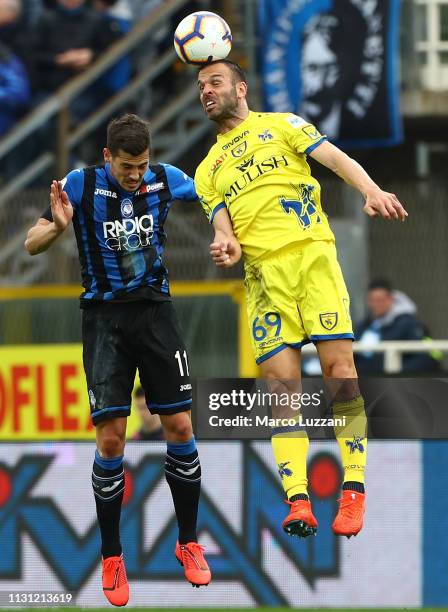 Riccardo Meggiorini of Chievo Verona competes for the ball with Remo Freuler of Atalanta BC during the Serie A match between Atalanta BC and Chievo...