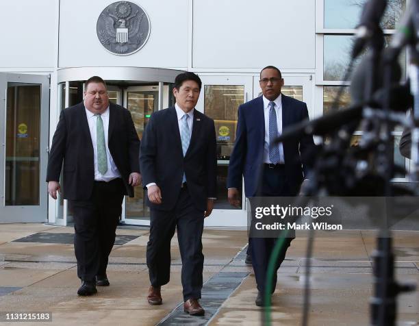 Attorney Robert Hur walks up to speak to the media while flanked by FBI Special Agent Gordon Johnson , and Art Walker of the Coast Guard...